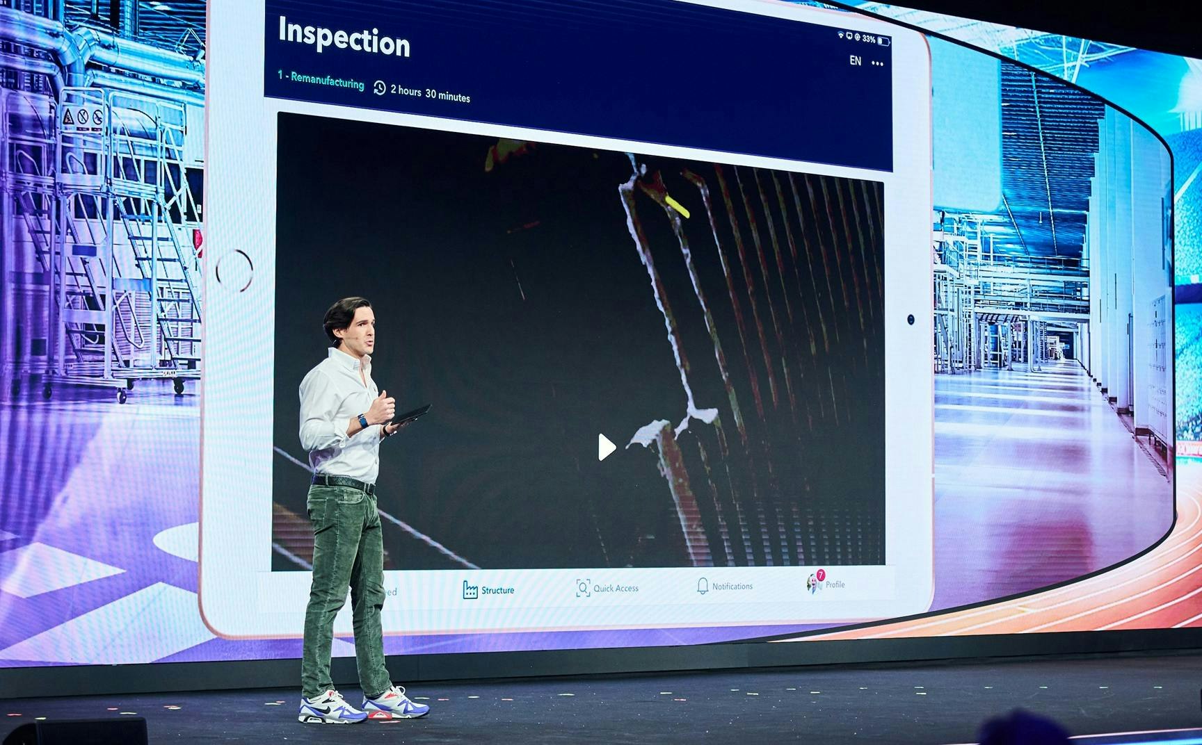 New Poka CEO Antoine Bisson speaks at an IFS sales meeting.